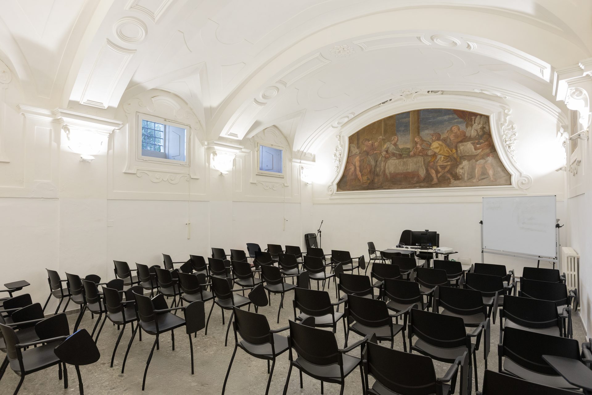 The Unicollege auditorium, beneath its historic painted vault