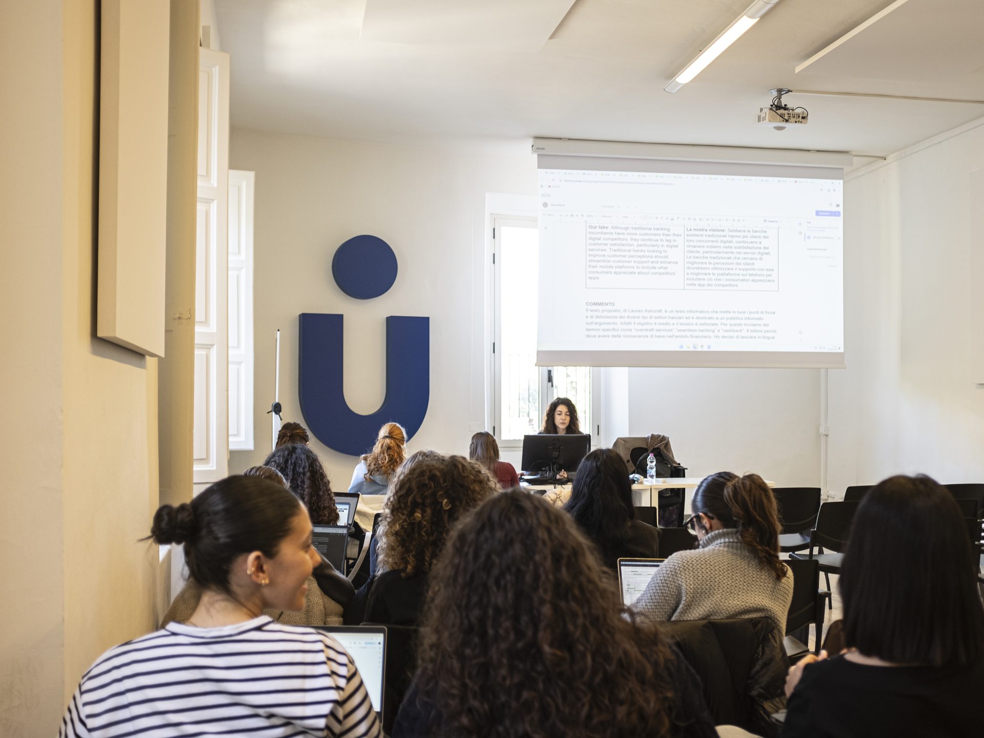 Students following a presentation in a Unicollege classroom