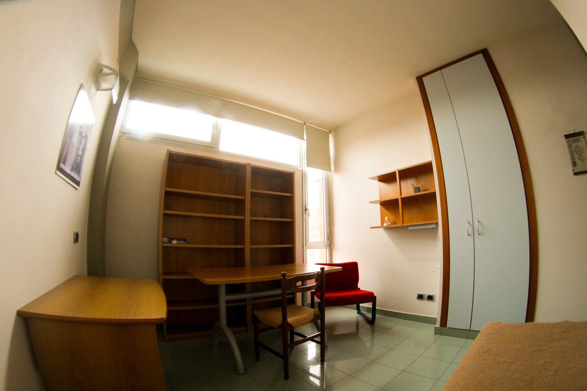 Study room with bookshelves at the Unicollege Mantua City College