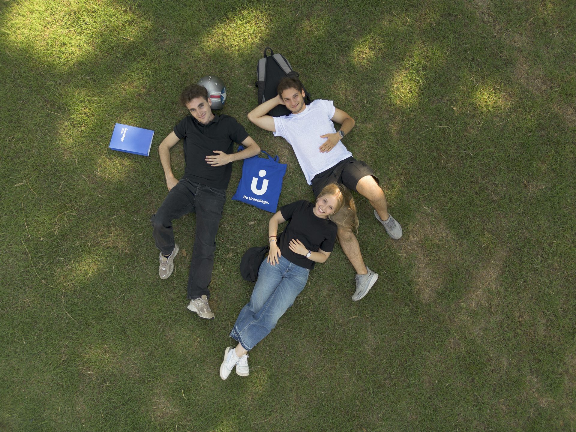 Unicollege students on the campus lawn, seen from above