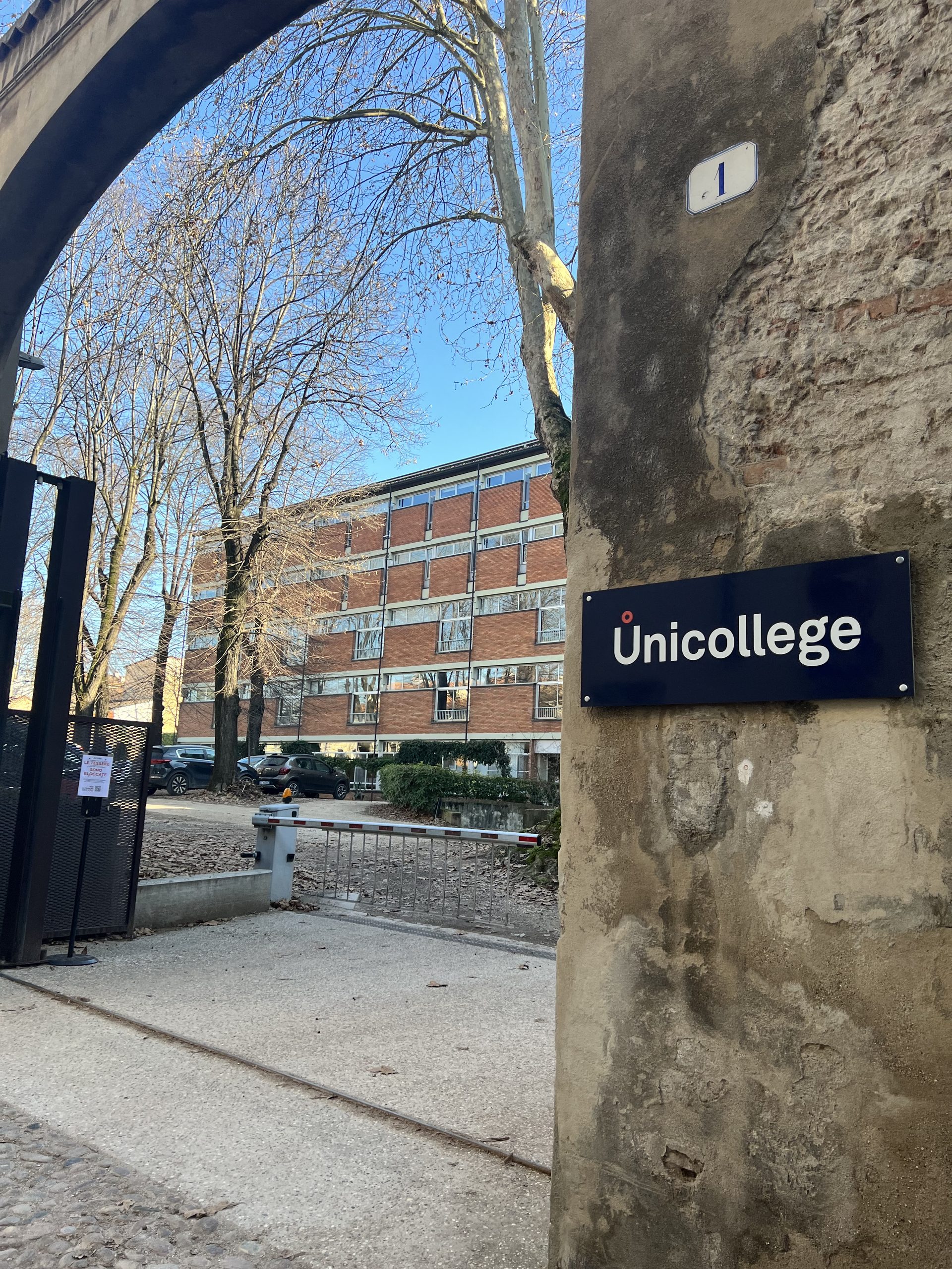 Unicollege signage on the historic wall of the Mantua City College