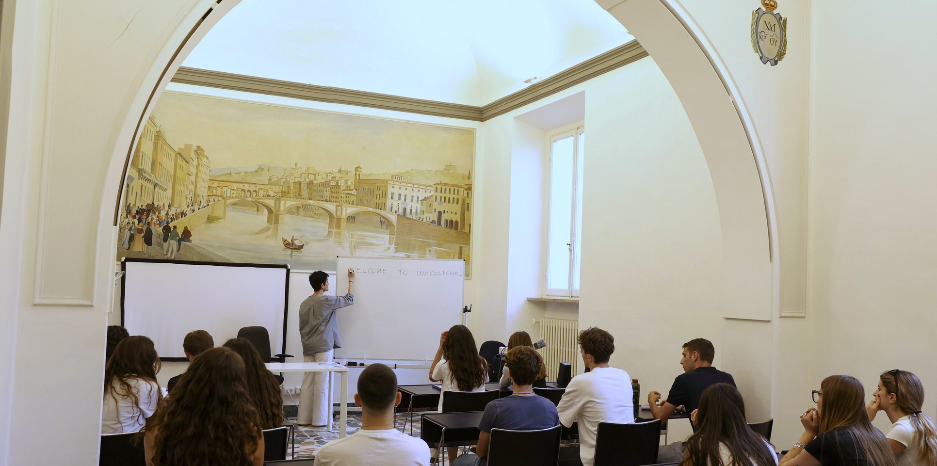 A class in the frescoed hall of the Unicollege Language Center