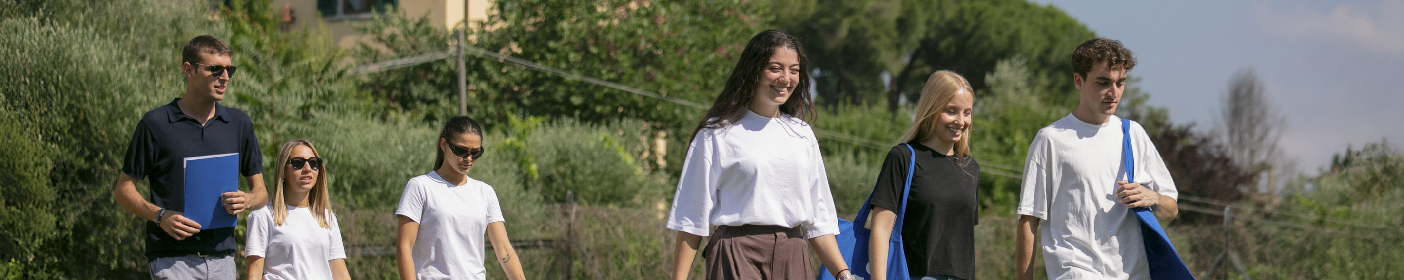 Unicollege students walking through the campus park